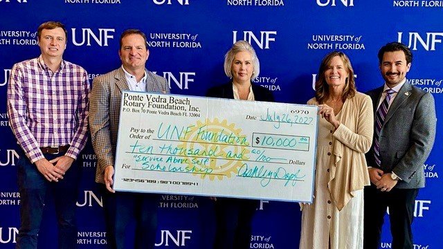 Rotary Club of Ponte Vedra Beach members present a check for $10,000 to the University of North Florida Foundation to establish the four-year “Service Above Self” scholarship. Pictured from left are 
UNF Political Science and Public Administration Chair and Professor Nicholas Seabrook; Ponte Vedra Beach Rotary Foundation Chair Billy Wagner; Teresa Nichols, UNF interim vice president for university development and alumni engagement; Ponte Vedra Beach Rotary Foundation Past Chair Ashley Dopf; and Kyle Musser, assistant director of development for the UNF College of Arts and Sciences.